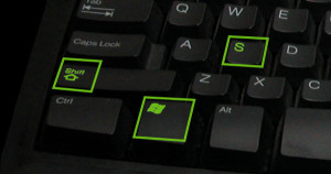 cropped photo of a Dell keyboard featuring the windows, shift, and s keys highlighted in green
